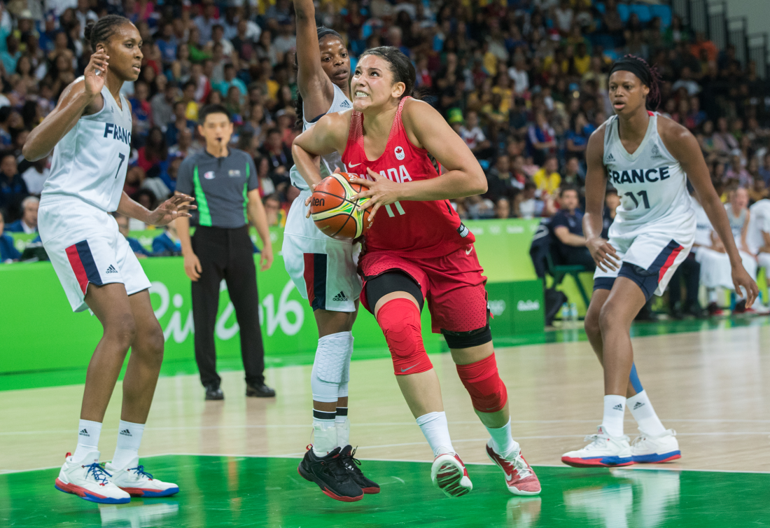 Canada's Natalie Achonwa drives ball against France 