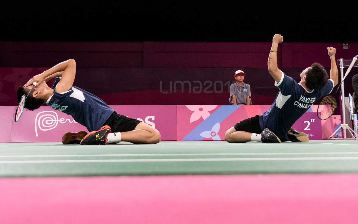 Badminton players celebrate a victory