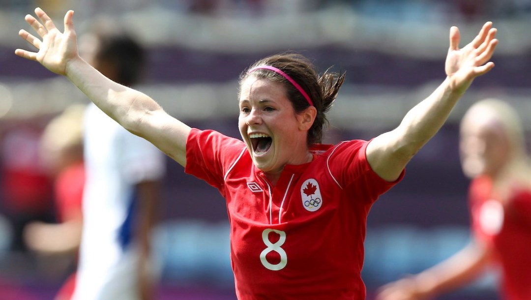 Diana Matheson celebrates after scoring a goal