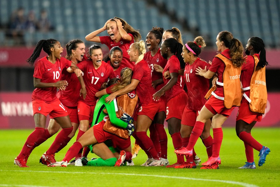 Canadian players celebrate after defeating Brazil