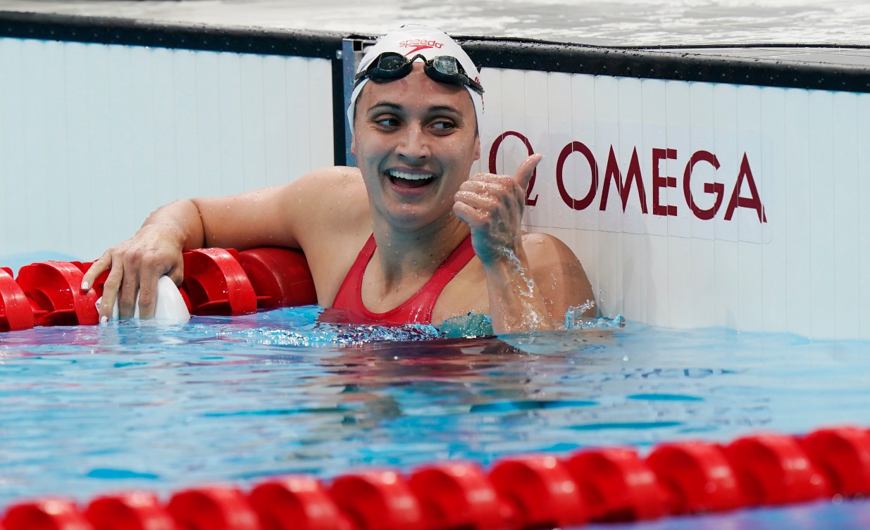 Kylie Masse celebrates after winning a medal