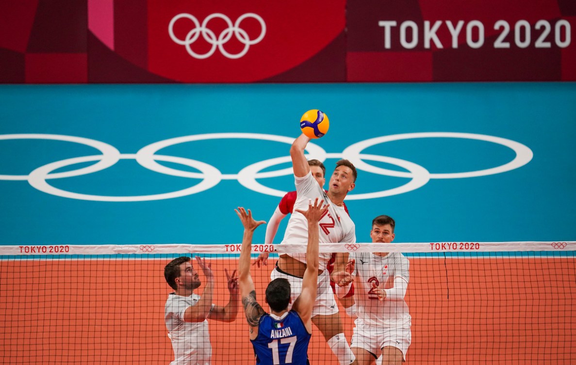 Canada middle blocker Lucas van Berkel #12 spikes the ball as Italy middle blocker Simone Anzani #17 attempts to block during the menís preliminary round at Ariake Arena during the Tokyo 2020 Olympic Games on Saturday,July 24, 2021. Photo by Leah Hennel/COC