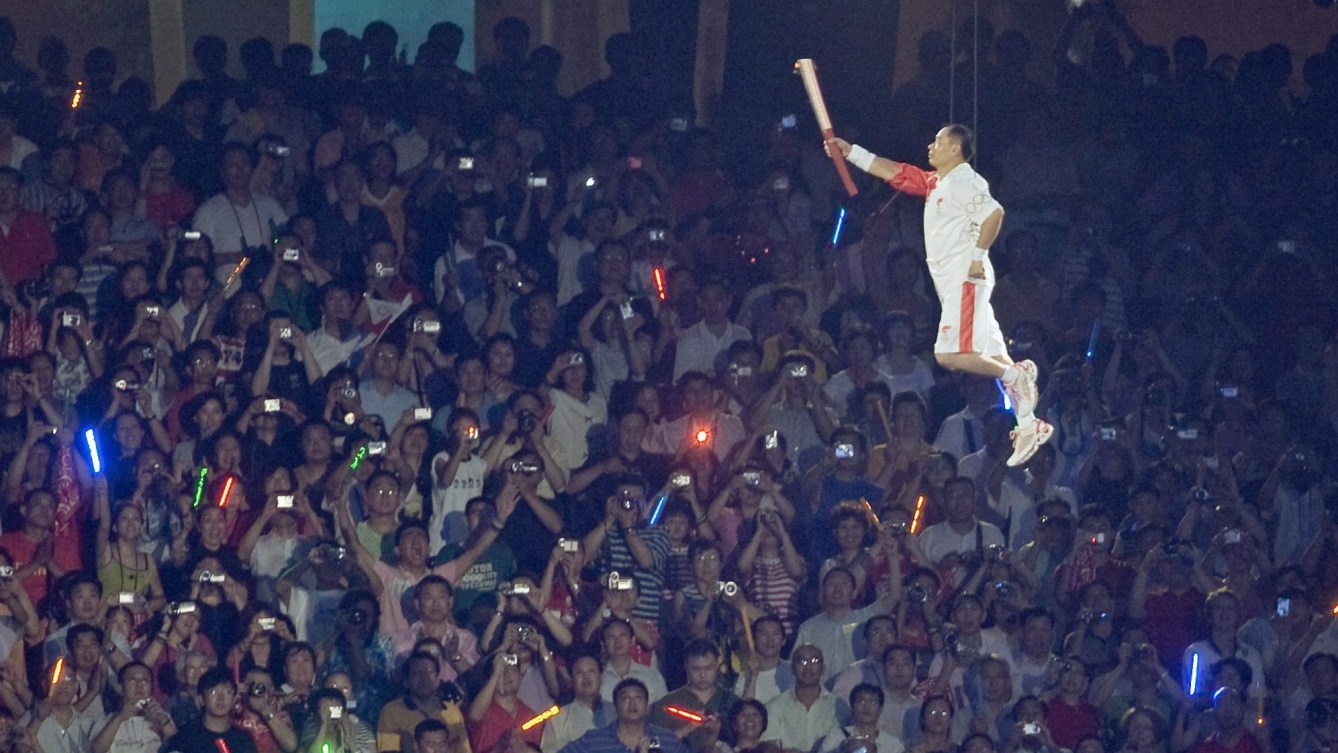 Li Ning with Olympic torch