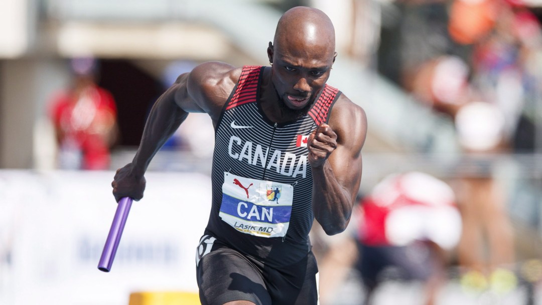 Bismark Boateng running with a relay baton