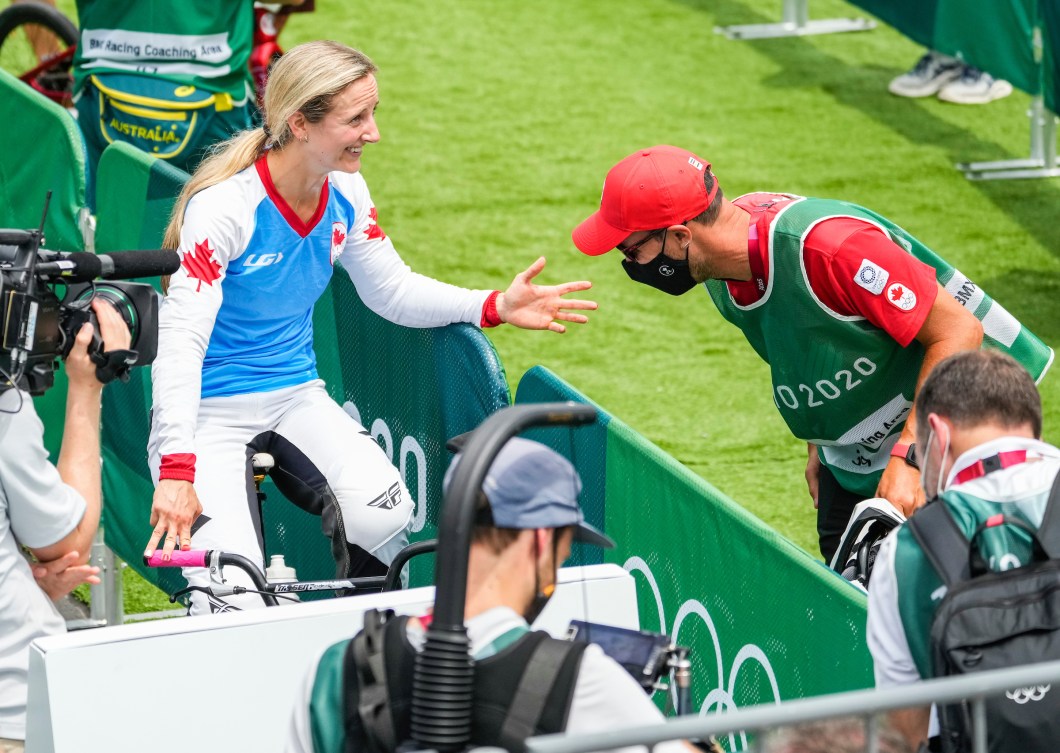 Drew Mechielsen reacts happily with her coach