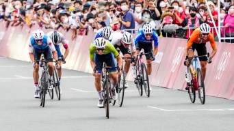 Michael Woods sprints for finish in road cycling race