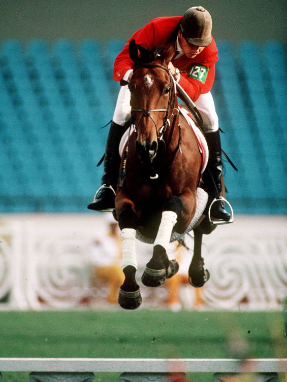 Canada's Mario Deslauriers rides horse at Olympics
