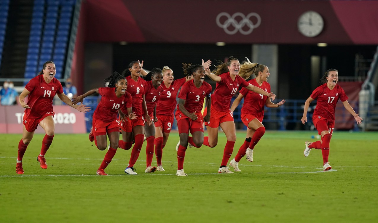 Canada players celebrate after the winning penalty kick