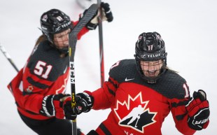 Canada's Ella Shelton, right, celebrates her goal with teammate Canada's Victoria Bach during second period IIHF Women's World Championship hockey action against Russia in Calgary, Alta., Sunday, Aug. 22, 2021. THE CANADIAN PRESS/Jeff McIntosh