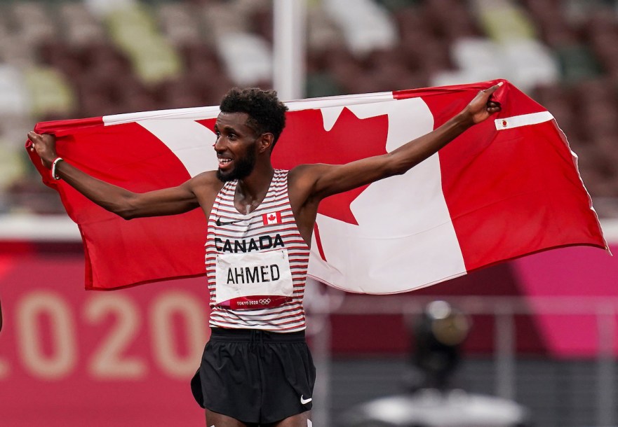 Canadian distance runner Mohammed Ahmed celebrates