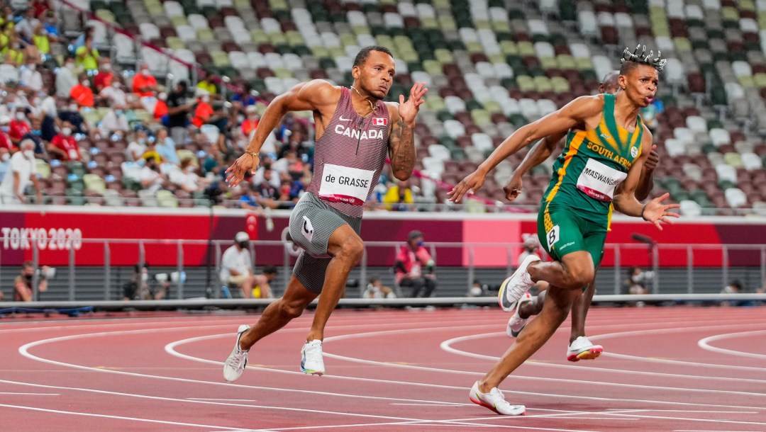Andre De Grasse running a curve in the 200m