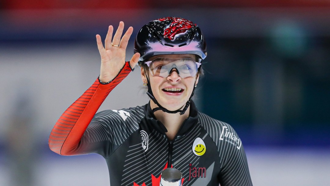 Kim Boutin waves and smiles after a race