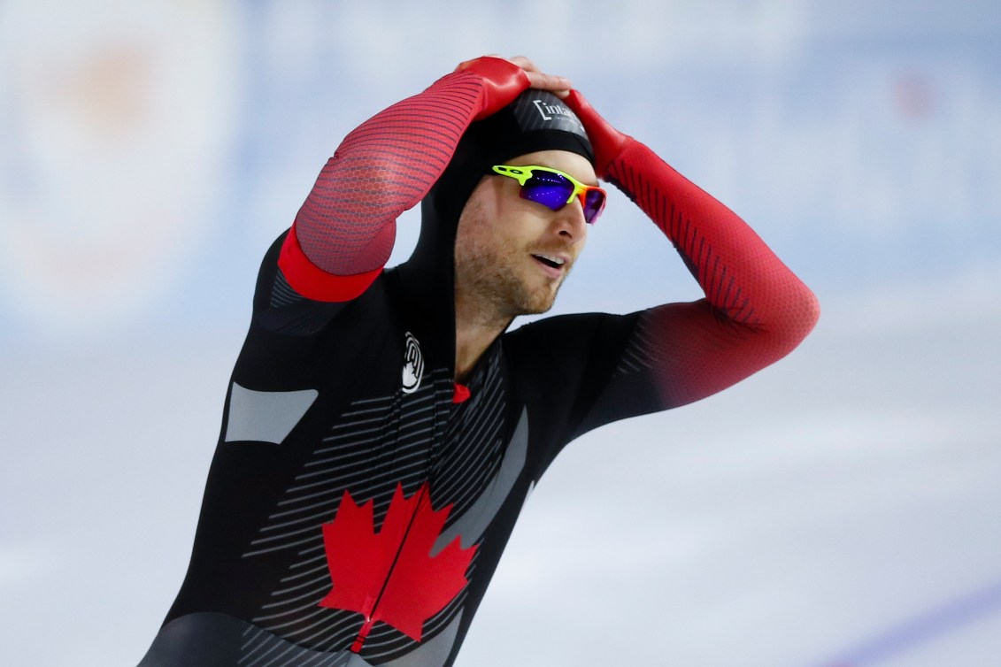 Laurent Dubreuil puts his hands on his head in reaction to winning gold 