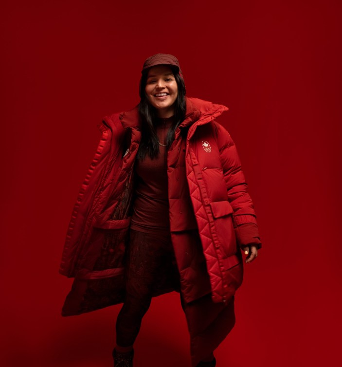 Brigette lacquette dressed in a red parka 