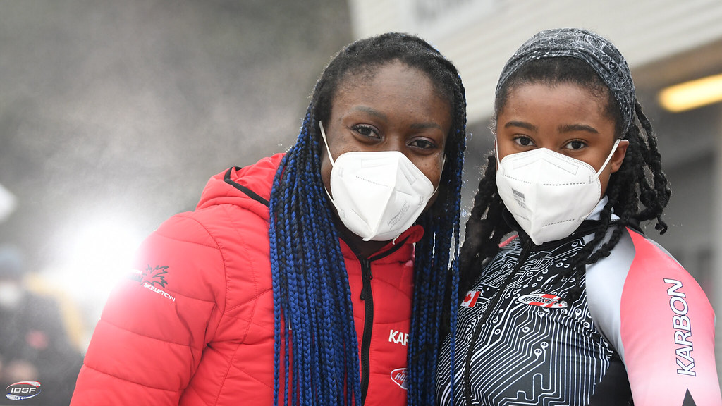 Cynthia Appiah (left) and Dawn Richardson Wilson pose for a photo. They are wearing masks.