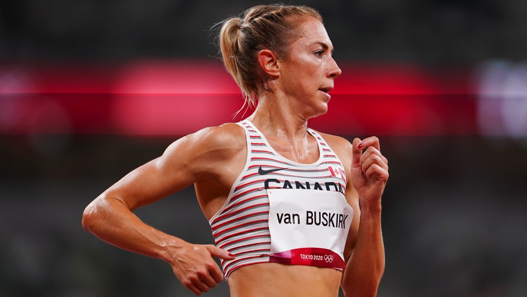 A profile shot from the waist up of a woman running.