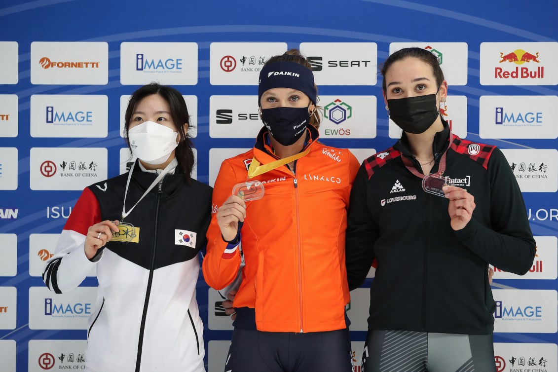 DEBRECEN, HUNGARY - NOVEMBER 20: Suzanne Schulting of Netherlands, Yubin Lee of South Korea and Courtney Sarault of Canada celebrate on podium after the Women`s 1500m final  during the ISU World Cup Short Track at Fönix hall on November 20, 2021 in Debrecen, Hungary. (Photo by Christian Kaspar-Bartke - International Skating Union/International Skating Union via Getty Images)