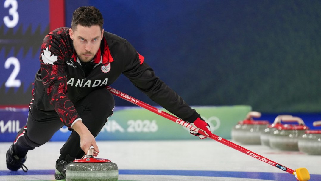 Brett Gallant throws a rock.