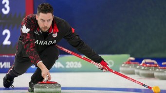 Brett Gallant throws a rock.