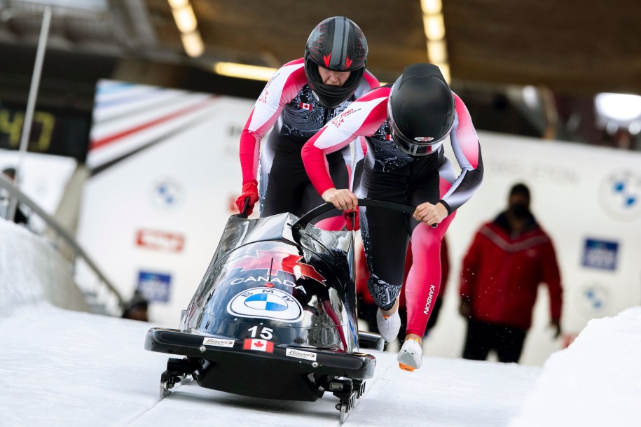 Christine de Bruin and Kristen Bujnowksi from Canada at the start of the women's two-women bobsleigh World Cup race in Igls, near Innsbruck, Austria, Sunday, Nov. 28, 2021. (AP Photo/Lisa Leutner)