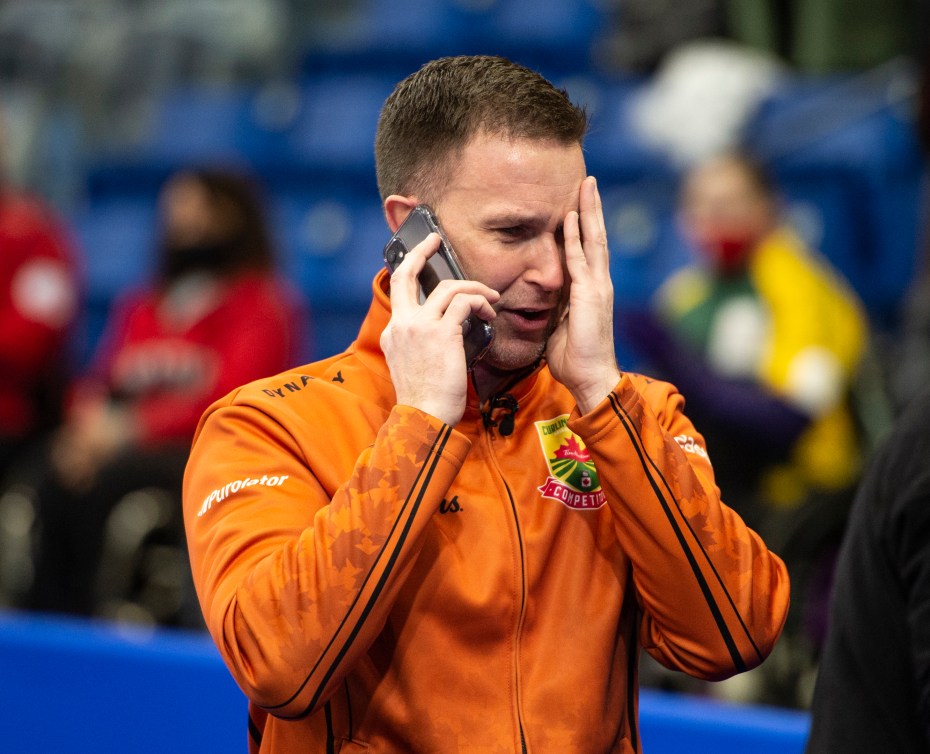 Brad Gushue cries while on the phone with his family after winning the Canadian Curling Trials 