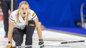 Jocelyn Peterman yells at her sweepers after throwing a stone