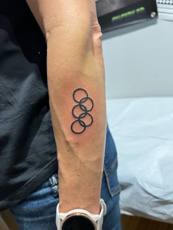 Close up of Catriona Le May Doan's Olympic rings tattoo