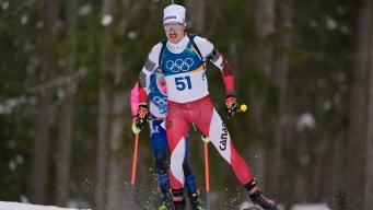Adam Runnalls competes in biathlon.