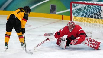 Emerance Maschmeyer competes in ice hockey.