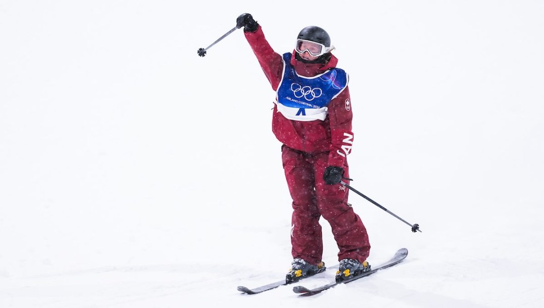 Megan Oldham reacts as she competes in freestyle skiing.