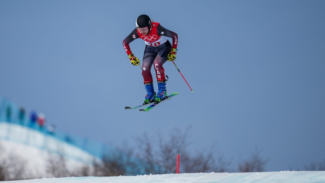 Hannah Schmidt goes over a jump on a ski cross course