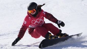Jennifer Hawkrigg leans as she carves an edge on her snowboard