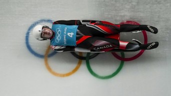 Makena Hodgson slides over Olympic rings on luge track
