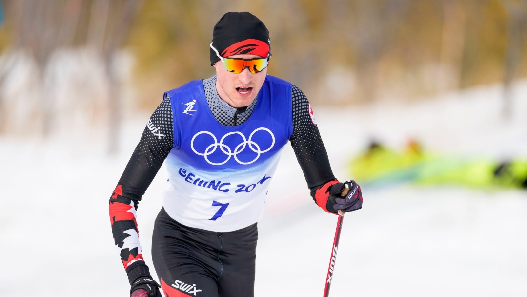 Close up of Remi Drolet in cross country skiing race
