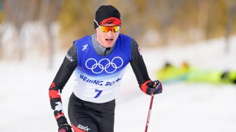 Close up of Remi Drolet in cross country skiing race