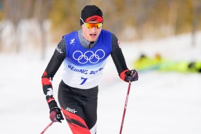 Close up of Remi Drolet in cross country skiing race