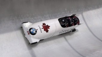 Bobsleigh slides through a curve in the track