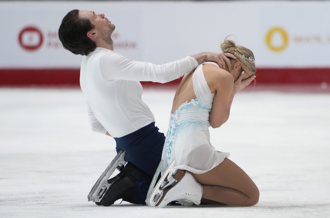 Kirsten Moore-Towers and Michael Marinaro cry in reaction at the end of their program