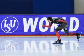 Connor Howe skates in a long track speed skating race