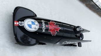 Cynthia Appiah and Dawn Richardson Wilson from Canada speed down the track during the women's two-women bobsleigh World Cup race in Igls, near Innsbruck, Austria, Sunday, Nov. 28, 2021.