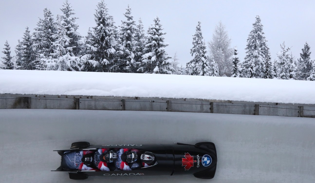 Team Christopher Spring, Mike Evelyn, Mark Mlakar and Chris Patrician of Canada speed down the run during the four-man bobsled race at the Bobsleigh and Skeleton World Championships in Altenberg, Germany, Saturday, Feb.13, 2021. 