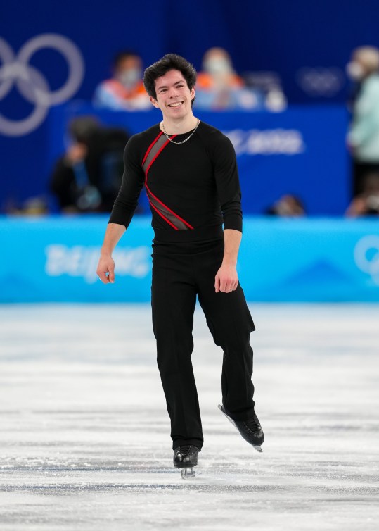 Keegan Messing smiles after finishing his short program