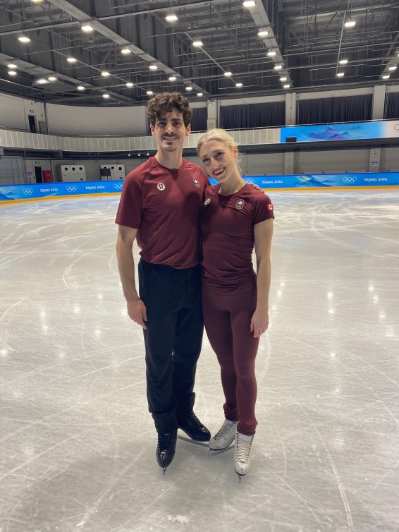 Piper Gilles and Paul Poirier finish a practice session before competition