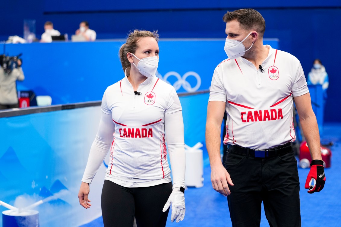 Team Canada curler Rachel Homan and John Morris during the Mixed Doubles Round Robin during the Beijing 2022 Olympic Winter Games on Thursday, February 03, 2022. Photo by Andrew Lahodynskyj/COC