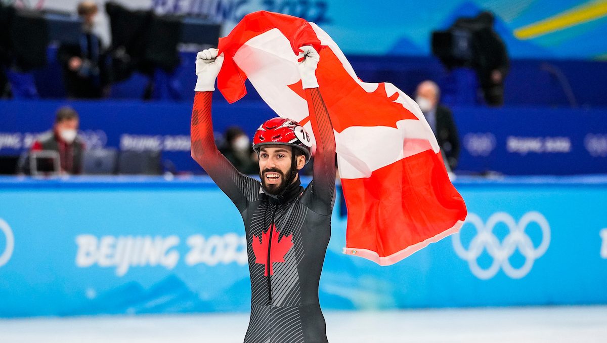 Steven Dubois waves Canadian flag
