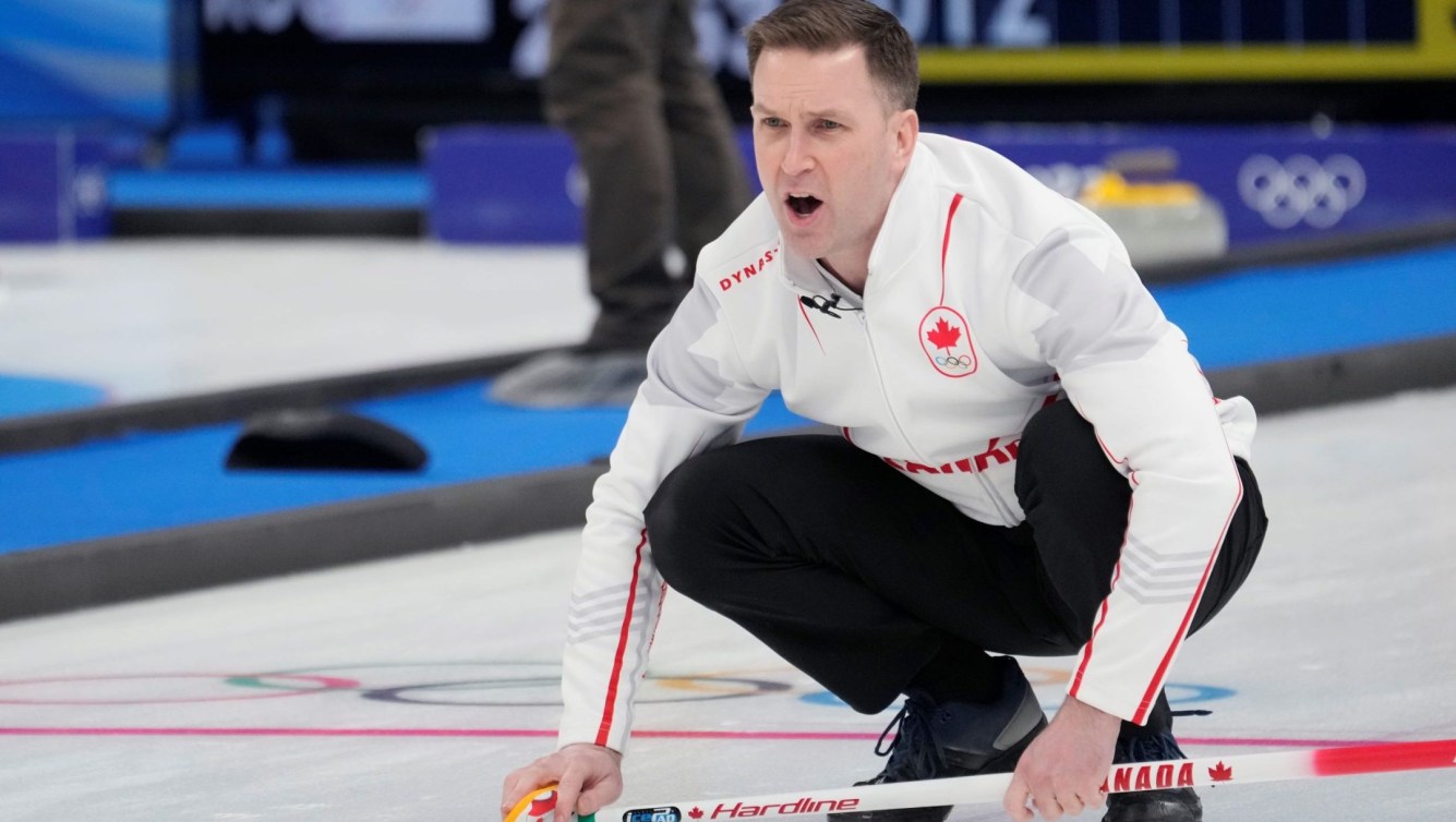 Brad Gushue yells as he calls a shot from the house