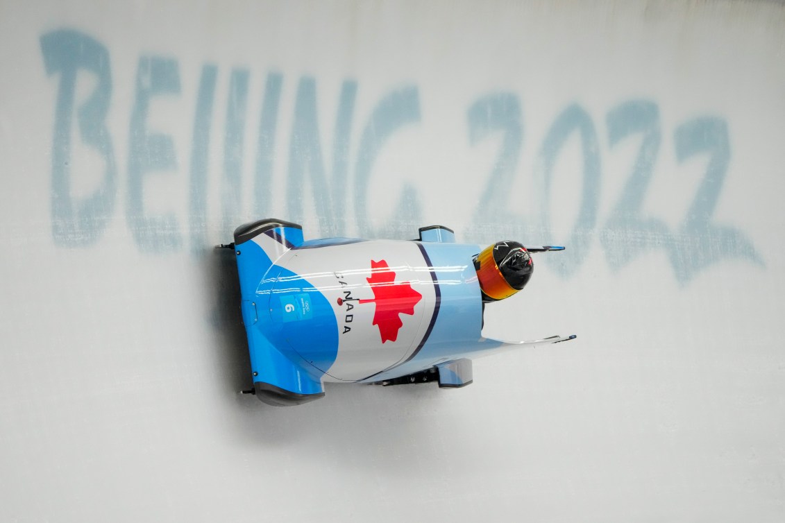 Cynthia Appiah, of Canada, drives during the women's monobob heat 2 at the 2022 Winter Olympics, Sunday, Feb. 13, 2022, in the Yanqing district of Beijing. (AP Photo/Dmitri Lovetsky)