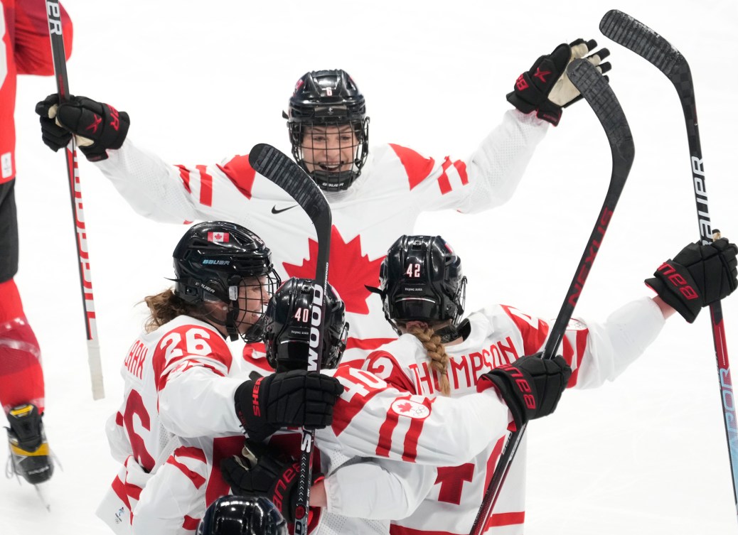 Canada defender Claire Thompson (42) celebrates her goal against Switzerland