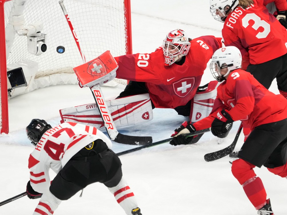 Canada forward Jamie Lee Rattray (47) scores on Switzerland