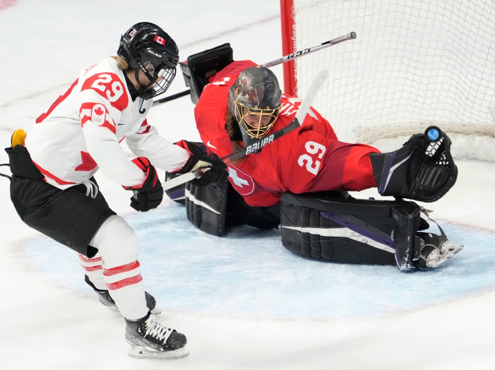 Canada forward Marie-Philip Poulin (29) scores on Switzerland